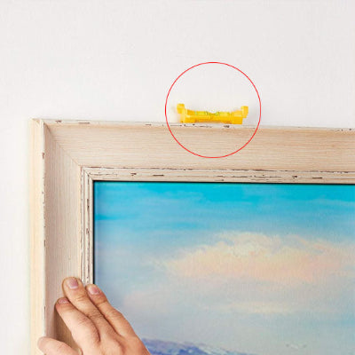Ajustement tableau peinture niveau posé dessus
