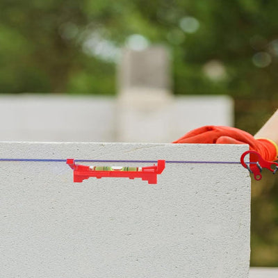 Alignement bloc béton niveau suspendu corde