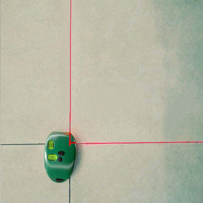 Niveau laser souris vertical lignes rouges sur joints carrelage
